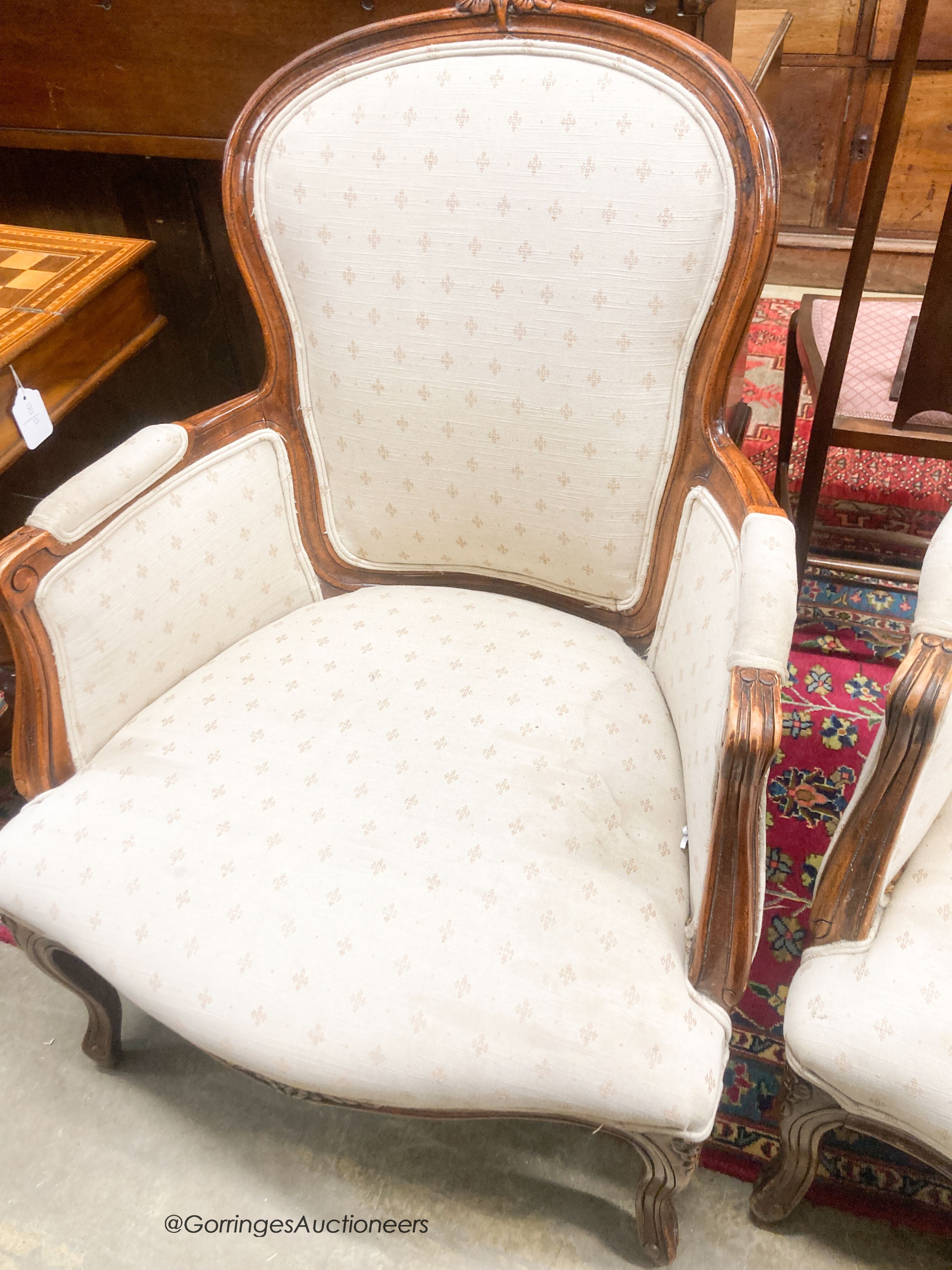 A pair of Louis XV style mahogany fauteuils, width 66cm, depth 55cm, height 94cm